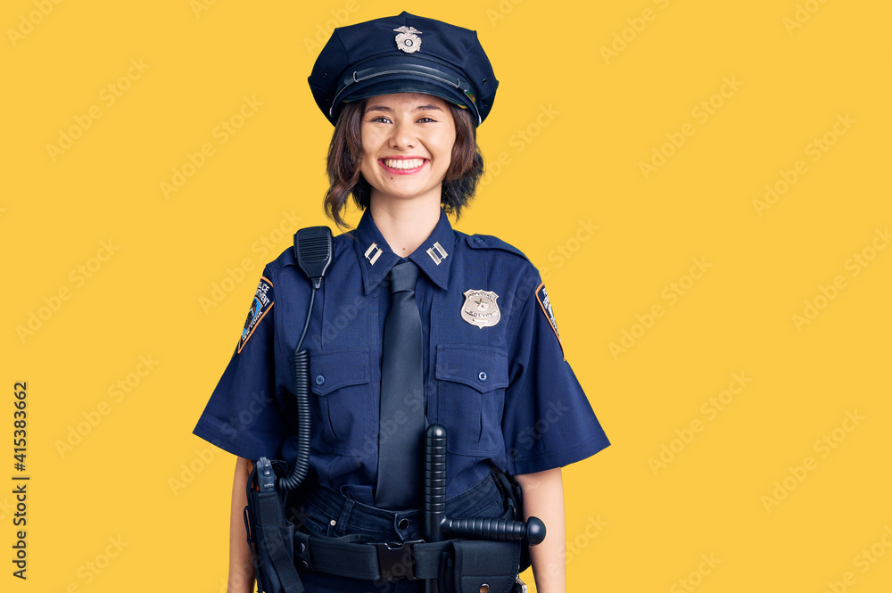 Young beautiful girl wearing police uniform with a happy and cool smile on face. lucky person. Young beautiful girl wearing police uniform with a happy and cool smile on face. lucky person.