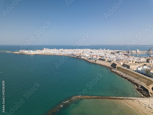 Drone panoramic view of Cadiz City. View of the south part of the city. In background the commercial harbour. Costa de Luz - Spain