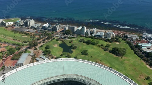 Aerial video scenic view of Signal Hill, Cape Town city center bowl, view of Table Bay, football stadium and Table Mountain in the background in Cape Town, South Africa on sunny day.