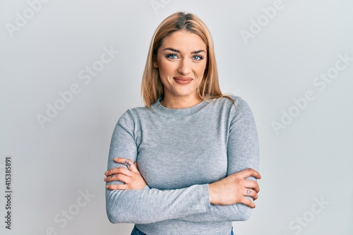 Young caucasian woman wearing casual clothes happy face smiling with crossed arms looking at the camera. positive person.