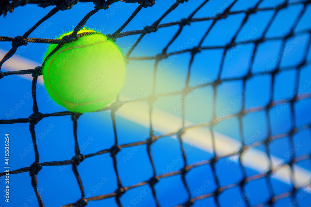 the tennis ball hits the net