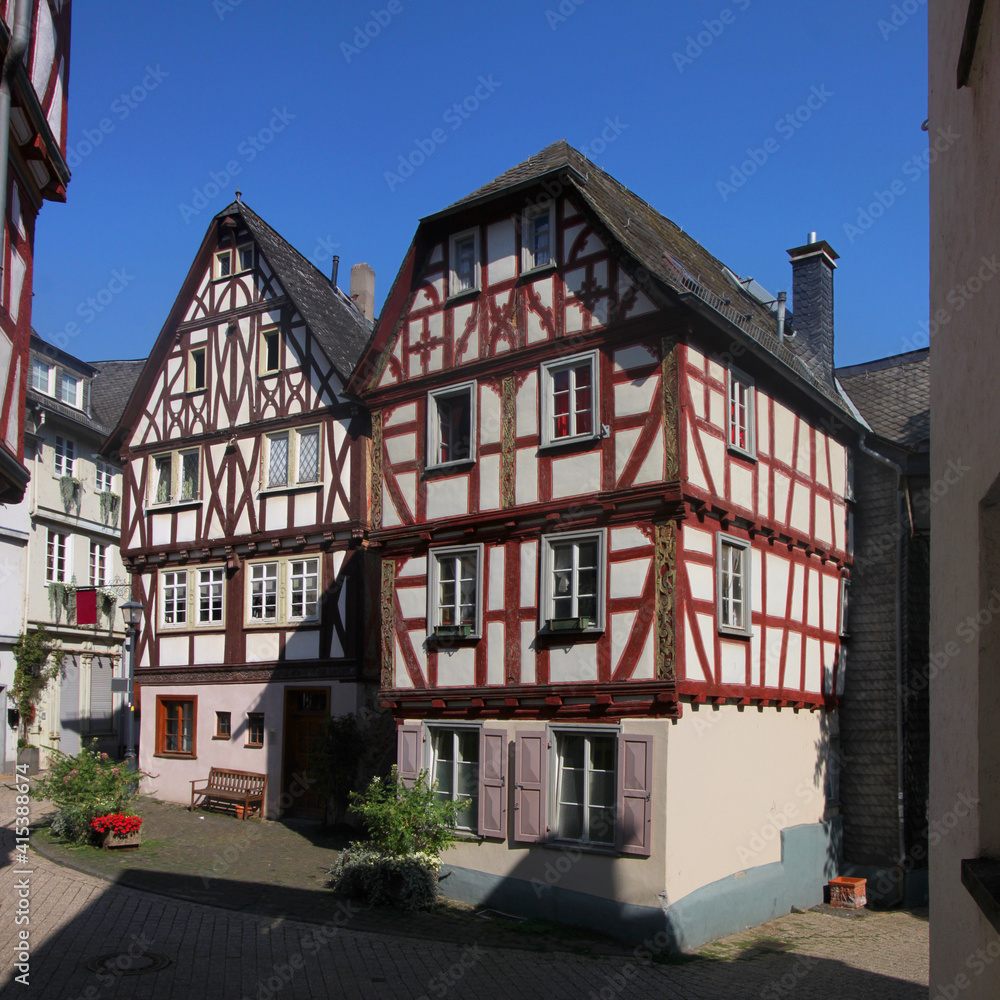 Two traditional half-timbered house facades at Brückengasse street in the old town of Limburg, Germany