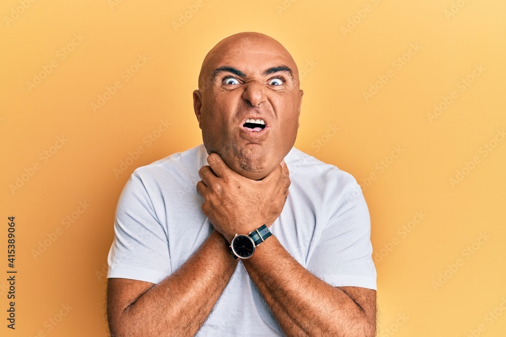 Mature middle east man wearing casual white tshirt shouting and suffocate because painful strangle. health problem. asphyxiate and suicide concept. Mature middle east man wearing casual white tshirt shouting and suffocate because painful strangle. health problem. asphyxiate and suicide concept.