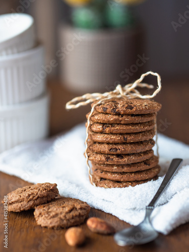 A stack of organic oatmeal cookies tied with rope.