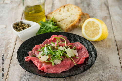 beef carpaccio with arugula capers and parmesan cheese