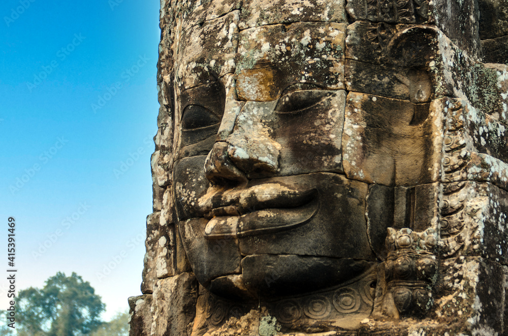 Face on Khmer temple near Angkor Wat