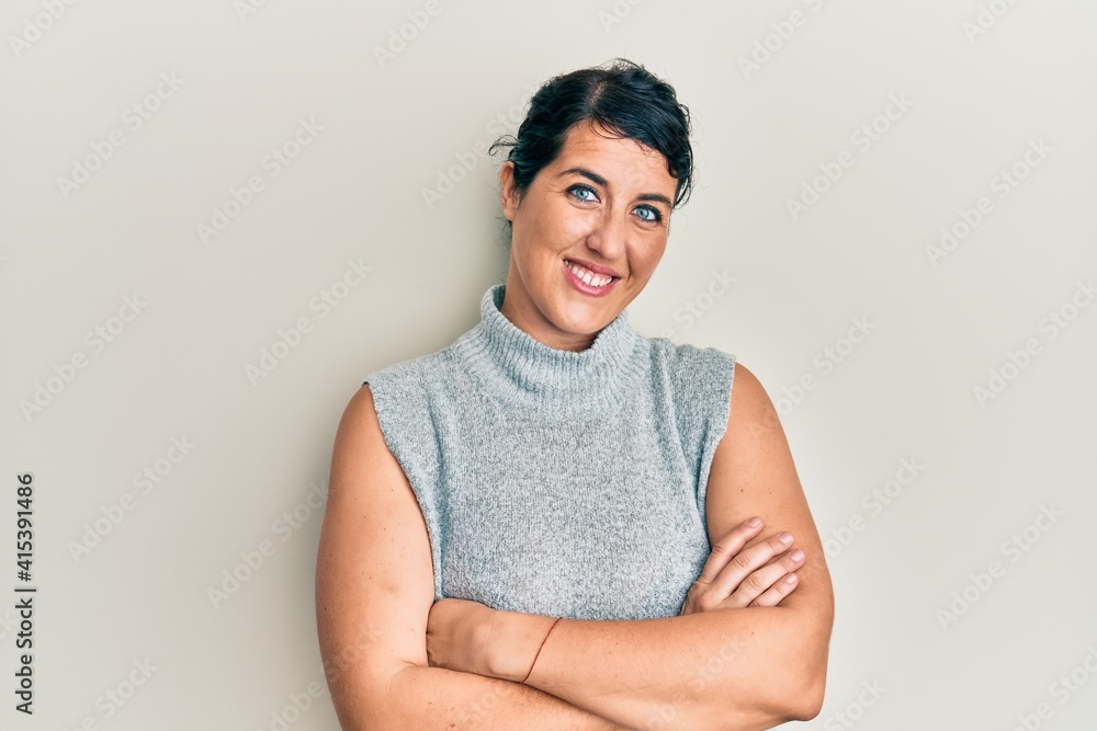 Obraz premium Plus size brunette woman wearing casual clothes happy face smiling with crossed arms looking at the camera. positive person.