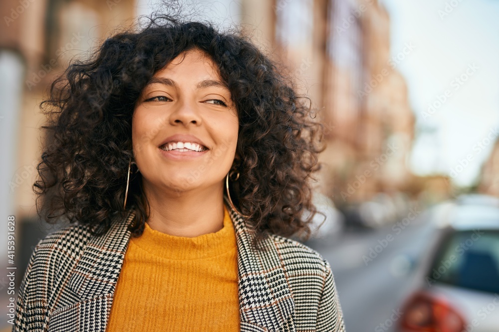 Young hispanic businesswoman smiling happy standing at the city. Young hispanic businesswoman smiling happy standing at the city.