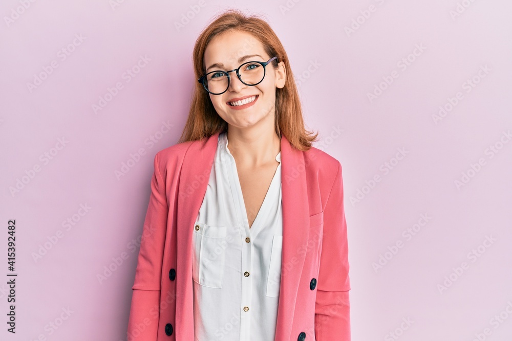 Young caucasian woman wearing business style and glasses with a happy and cool smile on face. lucky person.