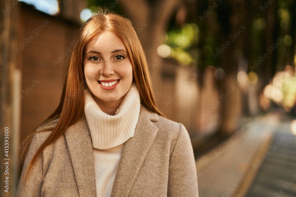 Young redhead girl smiling happy standing at the city. Young redhead girl smiling happy standing at the city.