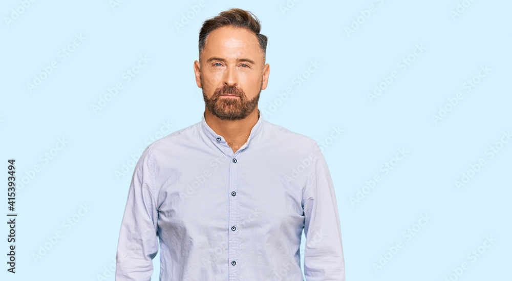 Handsome middle age man wearing business shirt skeptic and nervous, frowning upset because of problem. negative person. Handsome middle age man wearing business shirt skeptic and nervous, frowning upset because of problem. negative person.