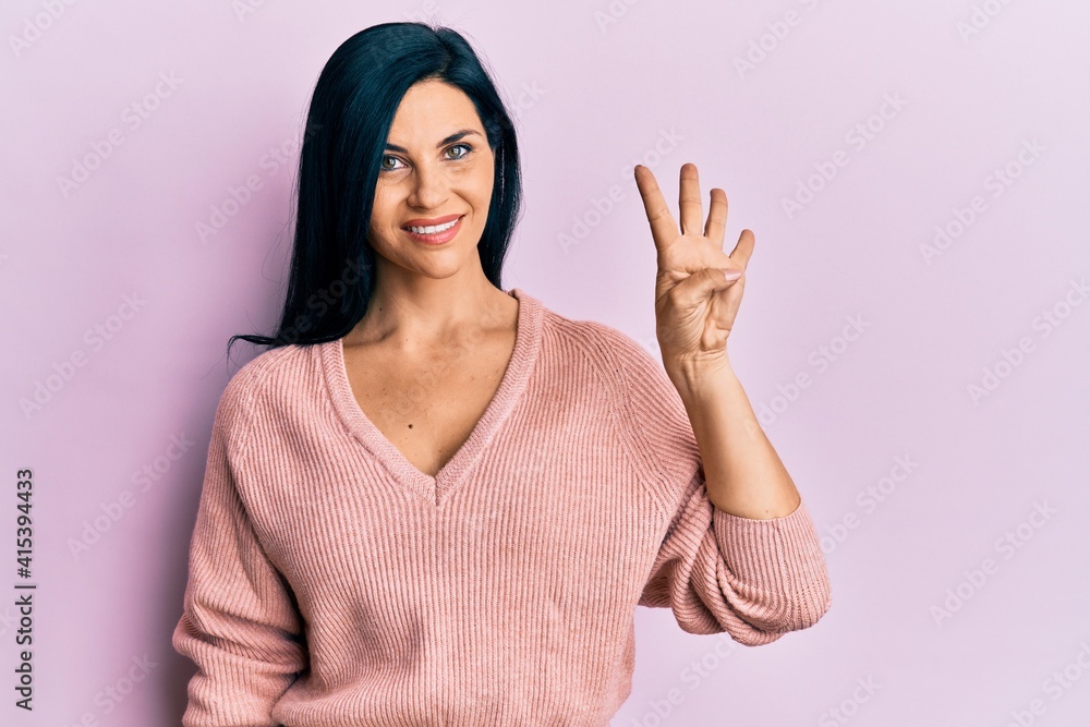 Young caucasian woman wearing casual clothes showing and pointing up with fingers number four while smiling confident and happy. Young caucasian woman wearing casual clothes showing and pointing up with fingers number four while smiling confident and happy.