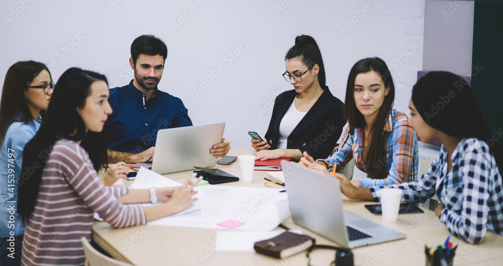 Group of colleagues working together in office Group of colleagues working together in office