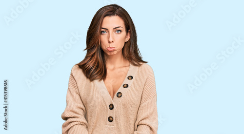 Young brunette woman wearing casual winter sweater depressed and worry for distress, crying angry and afraid. sad expression.