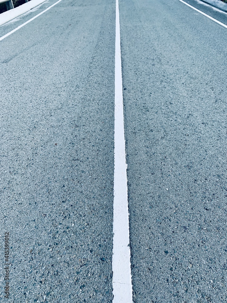 Fototapeta premium Asphalt road with white stripes