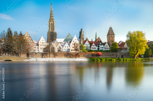 Fototapeta Naklejka Na Ścianę i Meble -  City ulm with river danube and minster in summer spring and in winter. Blend of different times to compare