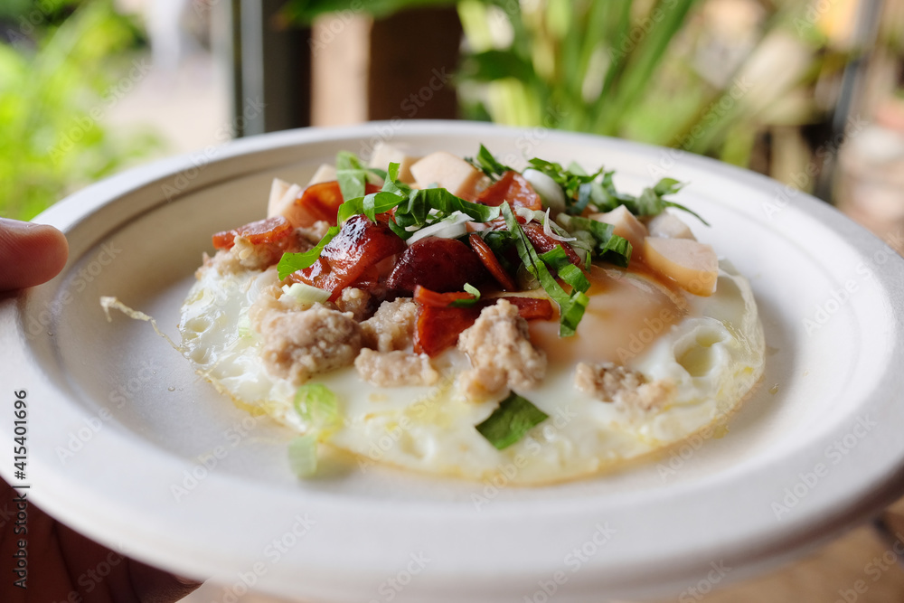 Indochina pan-fried egg with toppings is homemade Thai style and easy breakfast in the morning