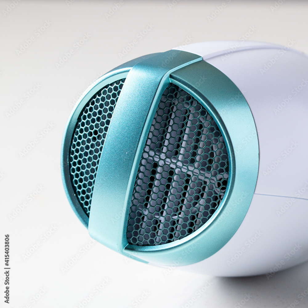 .View of ceramic ionic hairdryer detail . Modern device for hairstyling background. .View of ceramic ionic hairdryer detail . Modern device for hairstyling background.