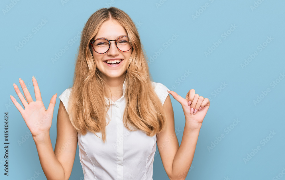 Fototapeta premium Beautiful young caucasian girl wearing casual clothes and glasses showing and pointing up with fingers number six while smiling confident and happy.