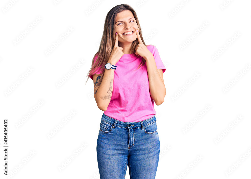 Beautiful caucasian woman wearing casual clothes smiling with open mouth, fingers pointing and forcing cheerful smile Beautiful caucasian woman wearing casual clothes smiling with open mouth, fingers pointing and forcing cheerful smile