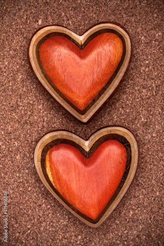 Two wooden hearts on rustic wood background. Valentines days concept. Love symbol. Greeting card.