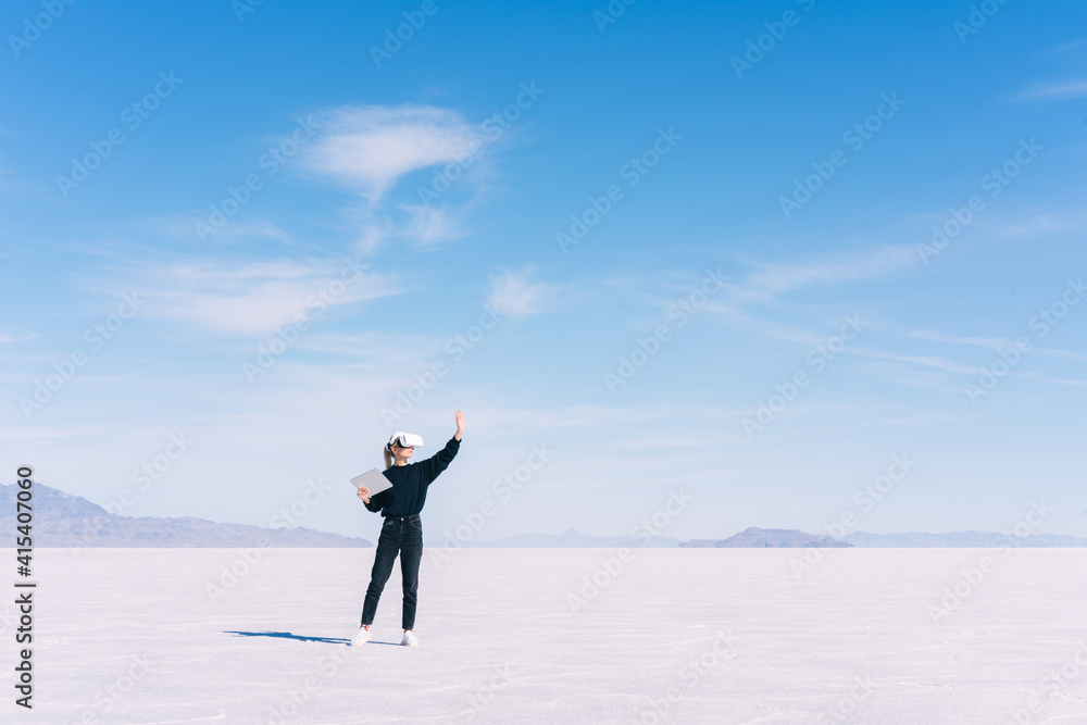 Obraz premium Unrecognizable woman in headset against cloudy sky