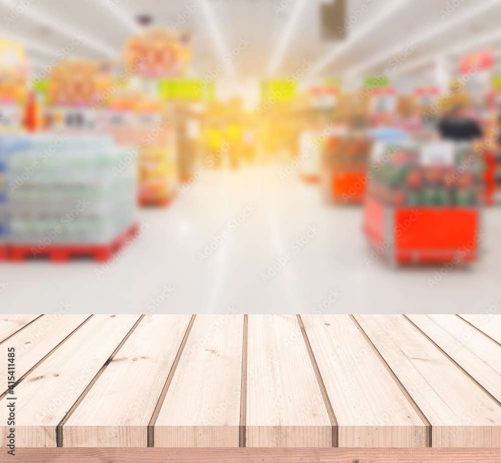 Wood table or Wood floor with supermarket or superstore blur background for product display
