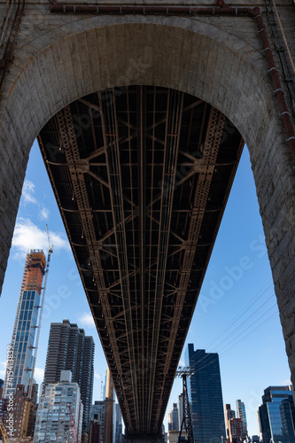 Below the Queensboro Bridge in New York City with Midtown Manhattan Skyscrapers