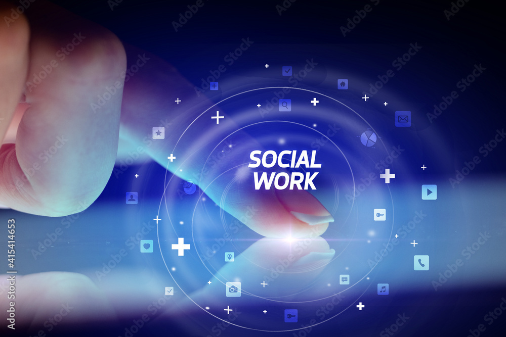 Finger touching tablet with social media icons and SOCIAL WORK Finger touching tablet with social media icons and SOCIAL WORK