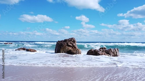 Awesome power of waves breaking over a rock in south coast of Sardinia island, Costa Rei