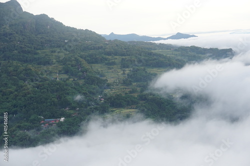 A breathtaking view when seeing beautiful morning light and the sea of fog at Lolai, Toraja Utara, Indonesia. This is the best place to see a sunrise