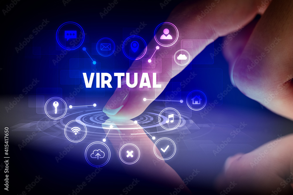 Finger touching tablet with web technology icons and VIRTUAL inscription, web technology concept Finger touching tablet with web technology icons and VIRTUAL inscription, web technology concept