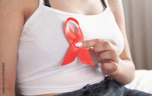 Wallpaper Mural Young woman holding red ribbon HIV. AIDS. Healthcare and medicine Torontodigital.ca
