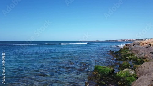 Awesome power of waves breaking over a rock in south coast of Sardinia island, San Giovanni del Sinis
