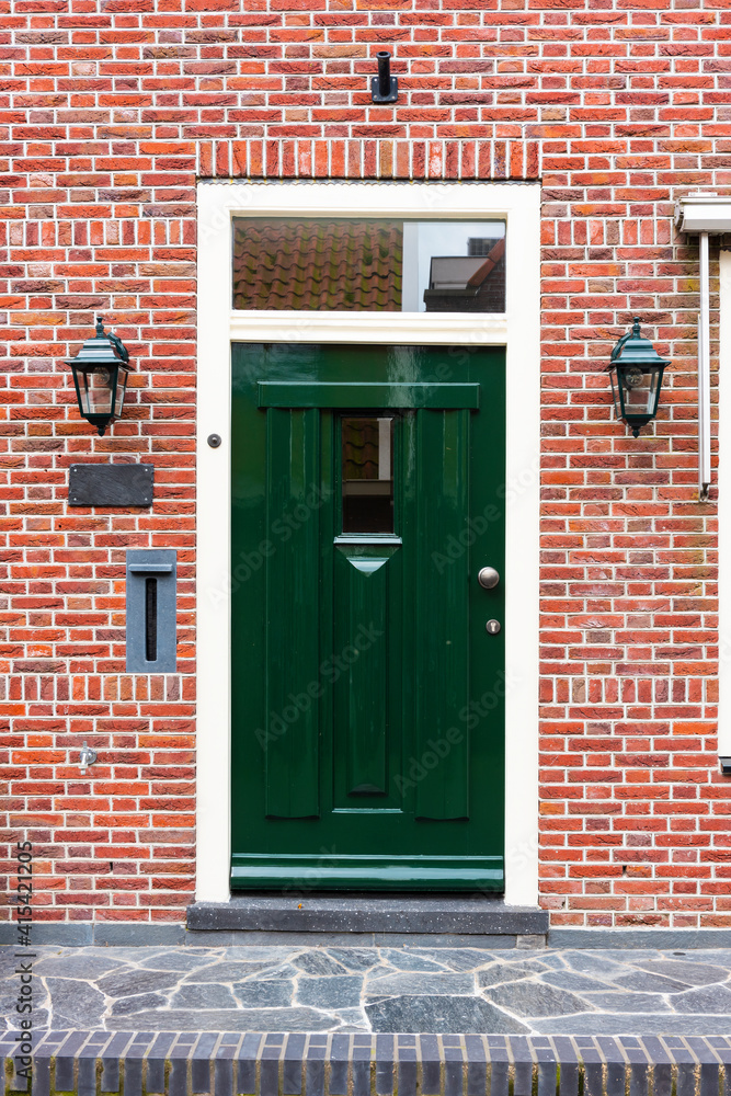 Naklejka premium VOLENDAM, NETHERLANDS. Typical Dutch village houses in Volendam. Beautiful village houses facade..