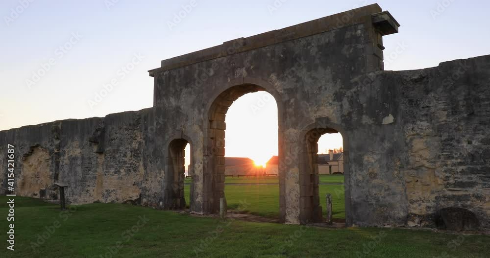 Locked of stationary motion of brick walls and ruins of the Penal Colony prison at kingston at late sunset, Mostly just surrounding walls remain, Kingston, Norfolk Island,Australia Locked of stationary motion of brick walls and ruins of the Penal Colony prison at kingston at late sunset, Mostly just surrounding walls remain, Kingston, Norfolk Island,Australia