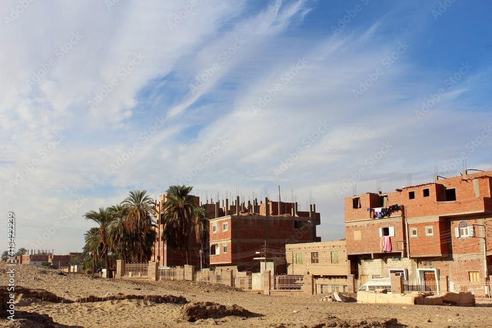 Houses in red bricks in a village beside Abydos temple in Sohag in Egypt