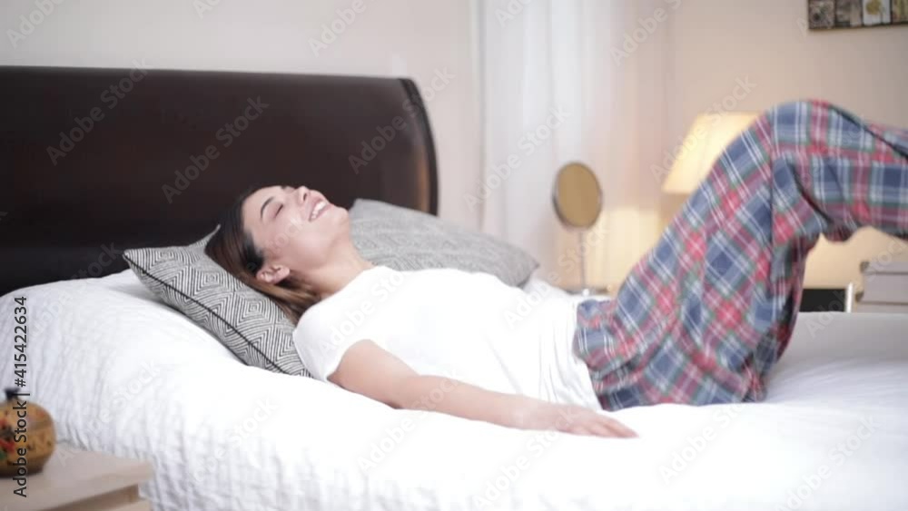 woman jump to relaxing on bed