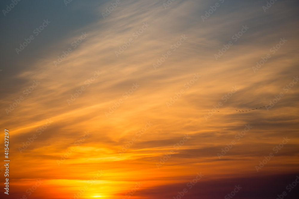 Colorful sunset sky and clouds with dramatic light and copy space
