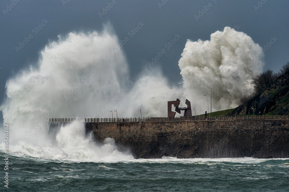Fototapeta premium Wave caused by big storm crashing coastline in San Sebastian Donostia