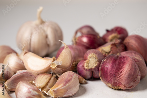 Red onion and garlic on a white background