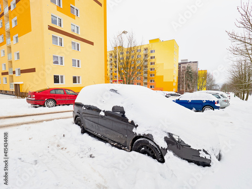 Parked car trapped in huge snow cover. The car was covered with sno