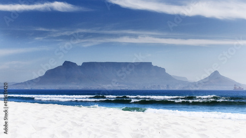 view of a beach with table mountain in the background
