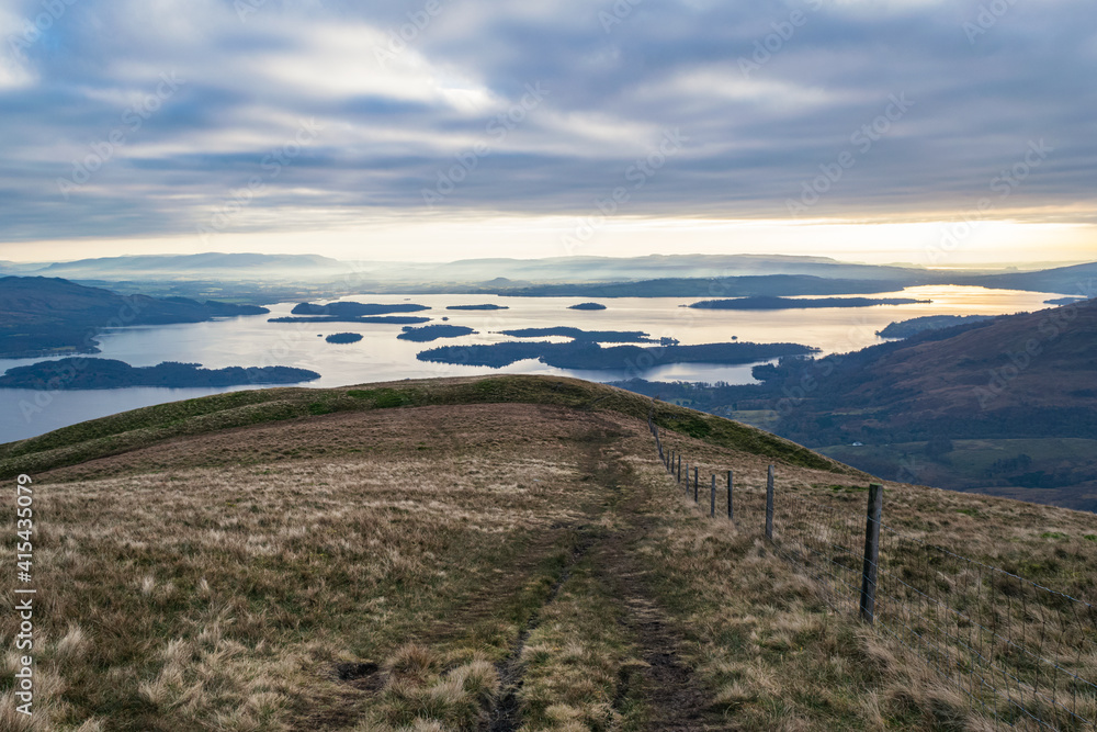 View from Beinn Dubh over Loch Lomond on an overcast morning after sunrise.