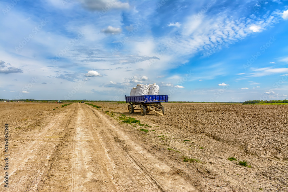 Fototapeta premium Agricultural work in the field in spring.