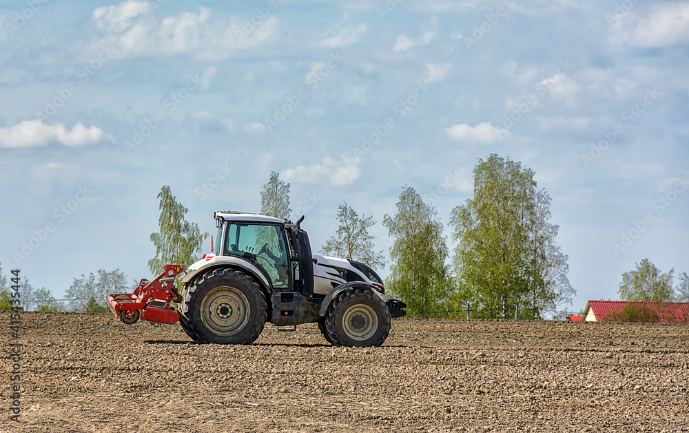 Fototapeta premium Agricultural work in the field in spring.