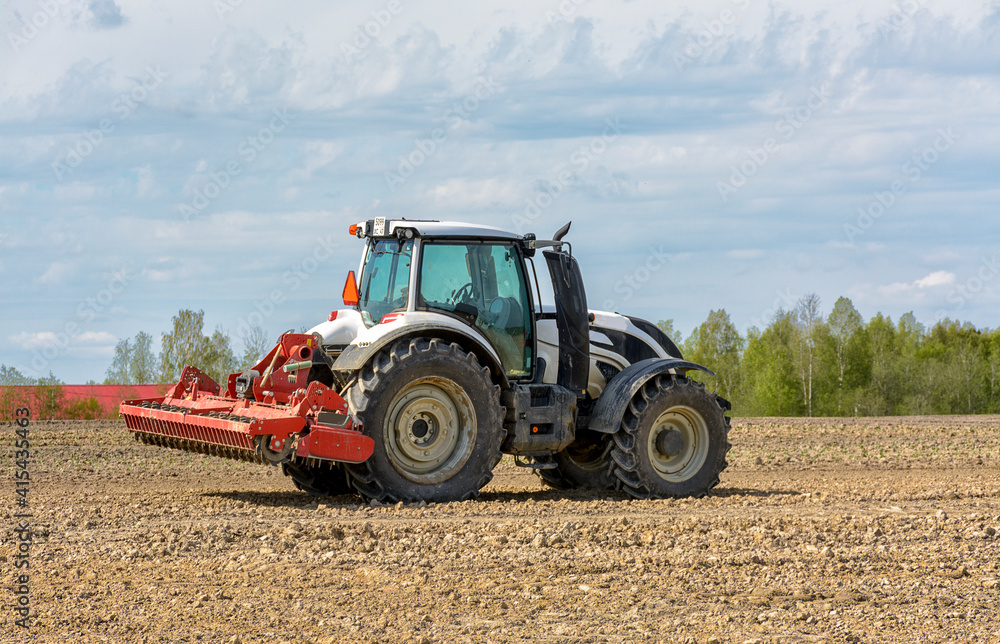 Agricultural work in the field in spring. Agricultural work in the field in spring.