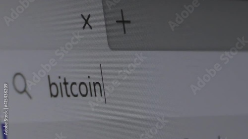 query in the search bar for the word bitcoin. someone types the word bitcoin in a line.