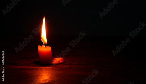 light candle burning brightly,Candle light close up on black background. Burning candle. Candle Flame. 