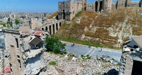 The Citadel of Aleppo from outside. We can see a lot of people going inside the citadel on a pond 4K